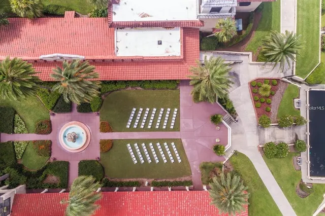 an outdoor space with seating area and sign board