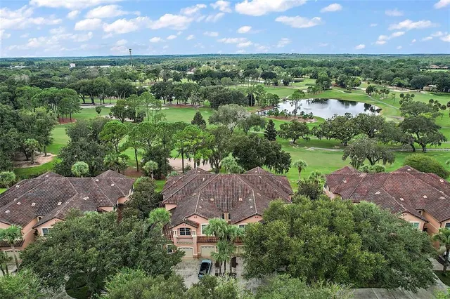 an aerial view of a house with a garden and a yard