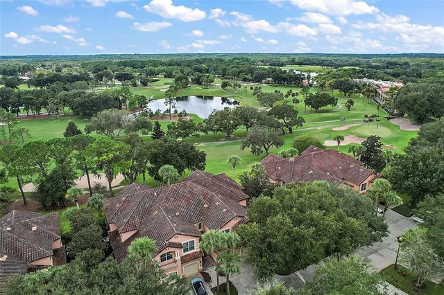 an aerial view of a house with a garden