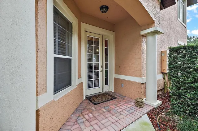 a view of a house with a door and a window