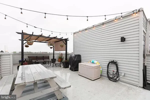 a view of a terrace with furniture