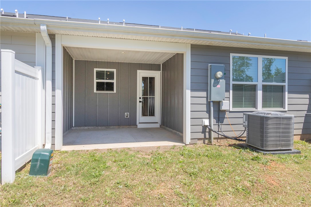 233 Scenic Road Anderson, SC 29621 - Photo 50 of 50 An inviting covered patio area offers a private space for outdoor enjoyment.