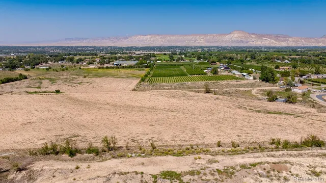 an aerial view of a house with a lake view