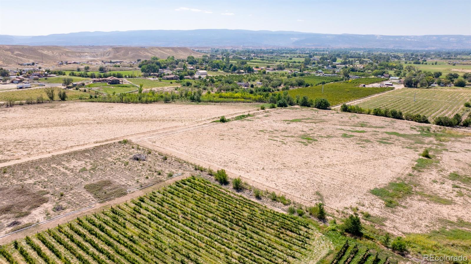 267 33 Road Palisade, CO 81526 - Photo 21 of 43 a view of a street with a houses