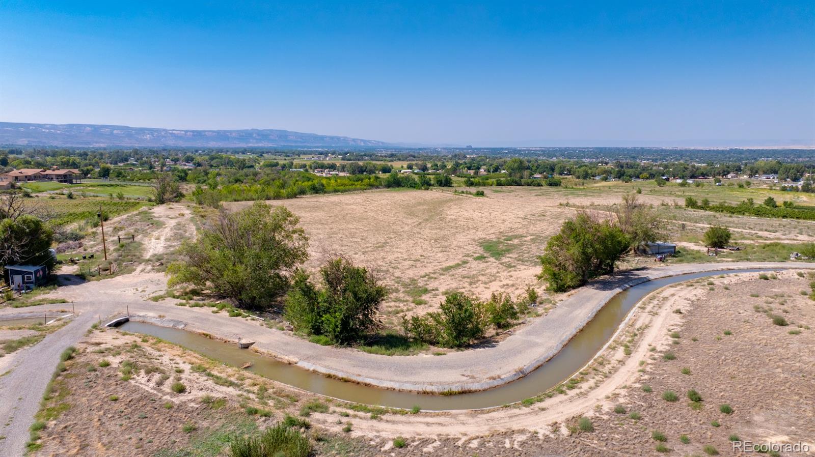 267 33 Road Palisade, CO 81526 - Photo 3 of 43 a view of a lake with a ocean view