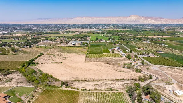 an aerial view of a house with a lake view