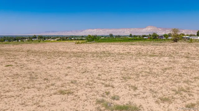 a view of a lake with houses in the back