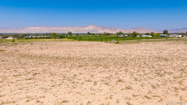 a view of an ocean beach and mountain