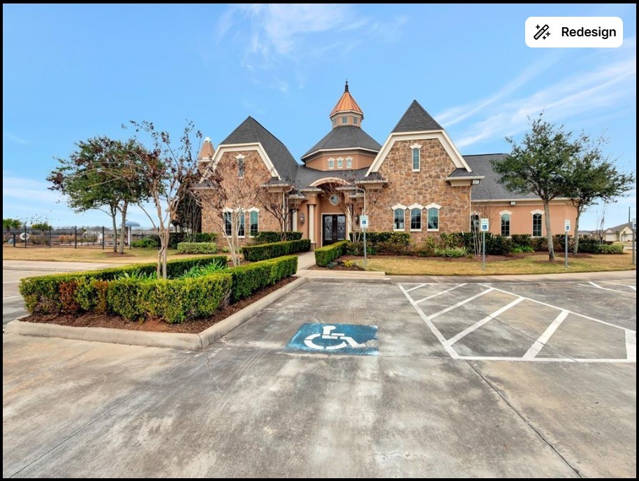 5514 Handlewood Lane Rosenberg, TX 77471 - Photo 3 of 6 This photo shows a charming, stone-accented building with a steeply pitched roof and turret, surrounded by well-maintained landscaping. The property features a paved parking area with accessible spaces.