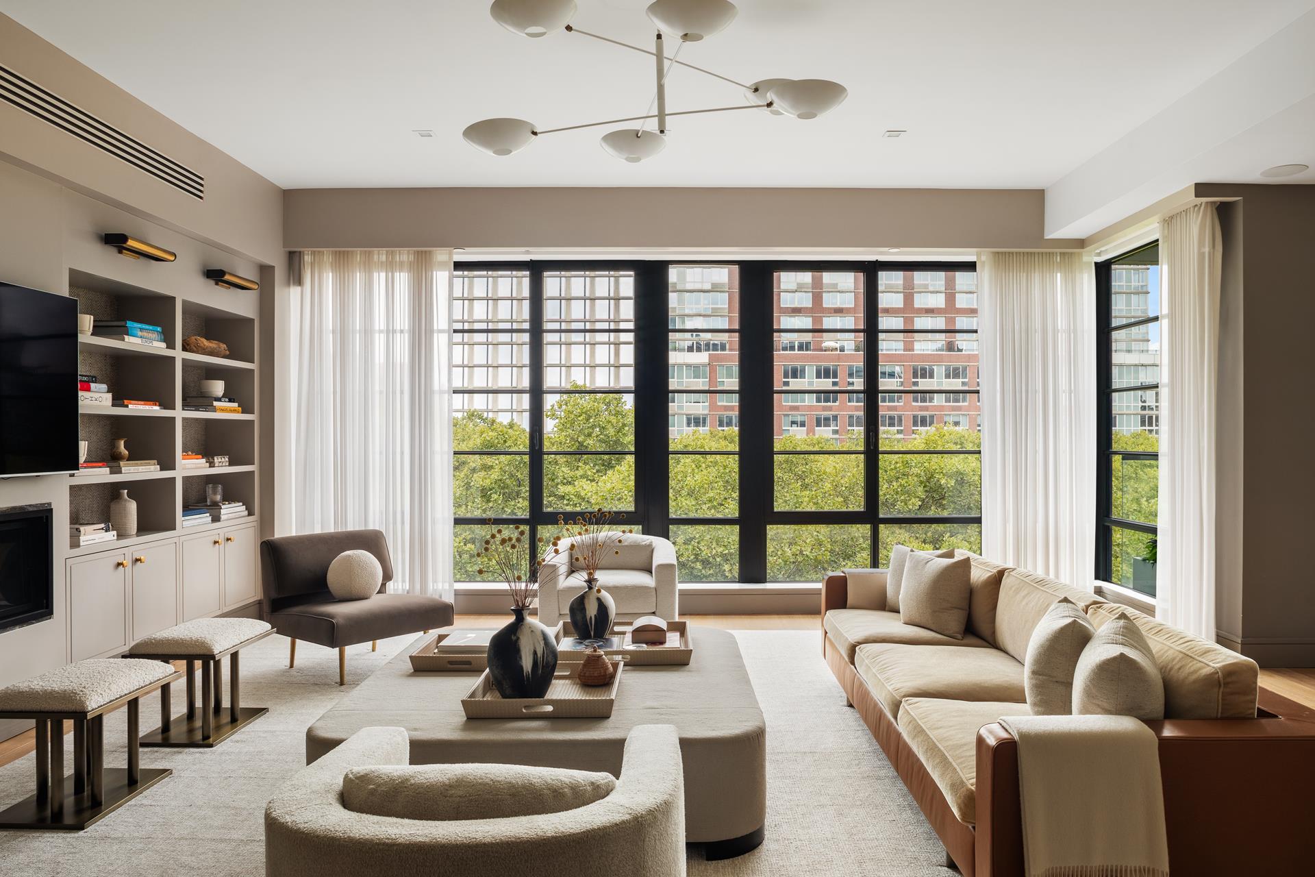 204 Forsyth Street, Unit PH6 Manhattan, NY 10002 - Photo 1 of 22 a living room with furniture and a large window
