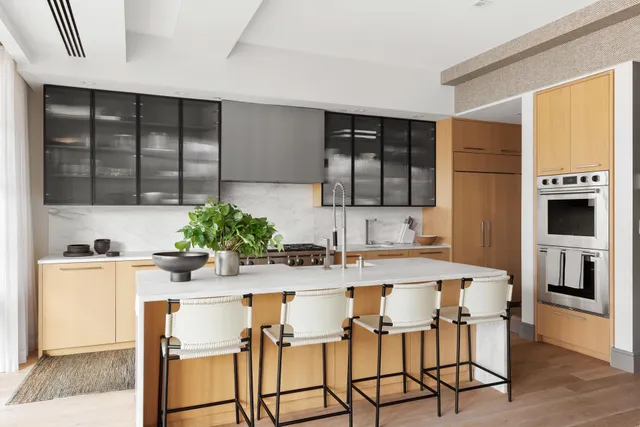 a kitchen with a stove a sink and a refrigerator