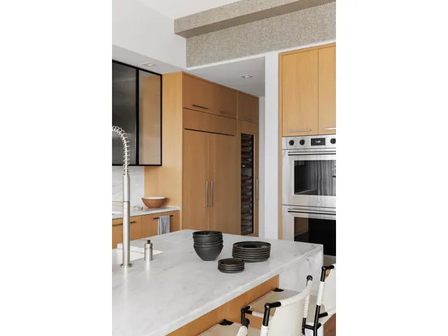 a kitchen with a table and chairs in it