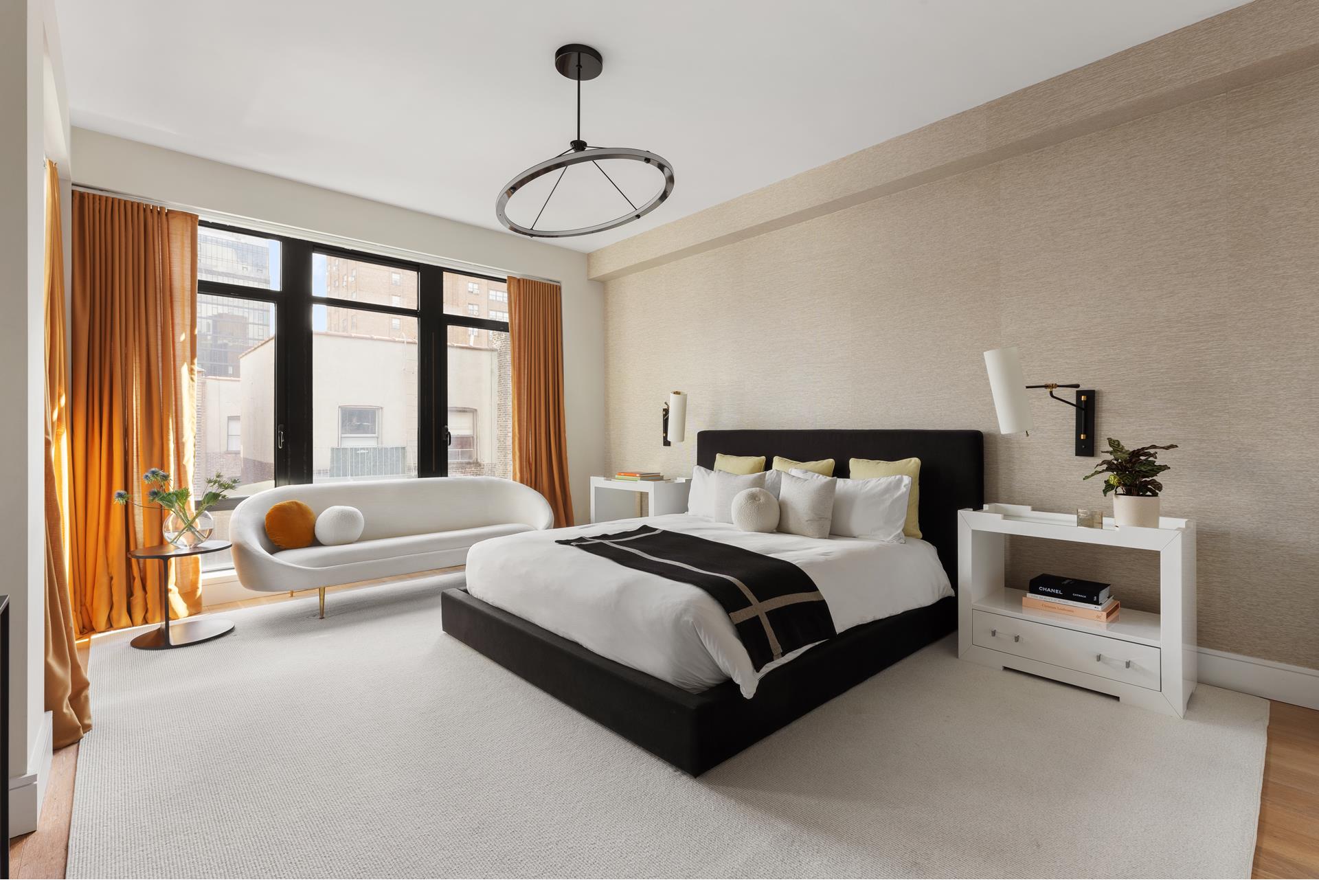 204 Forsyth Street, Unit PH6 Manhattan, NY 10002 - Photo 12 of 22 a spacious bedroom with a bed and a large window