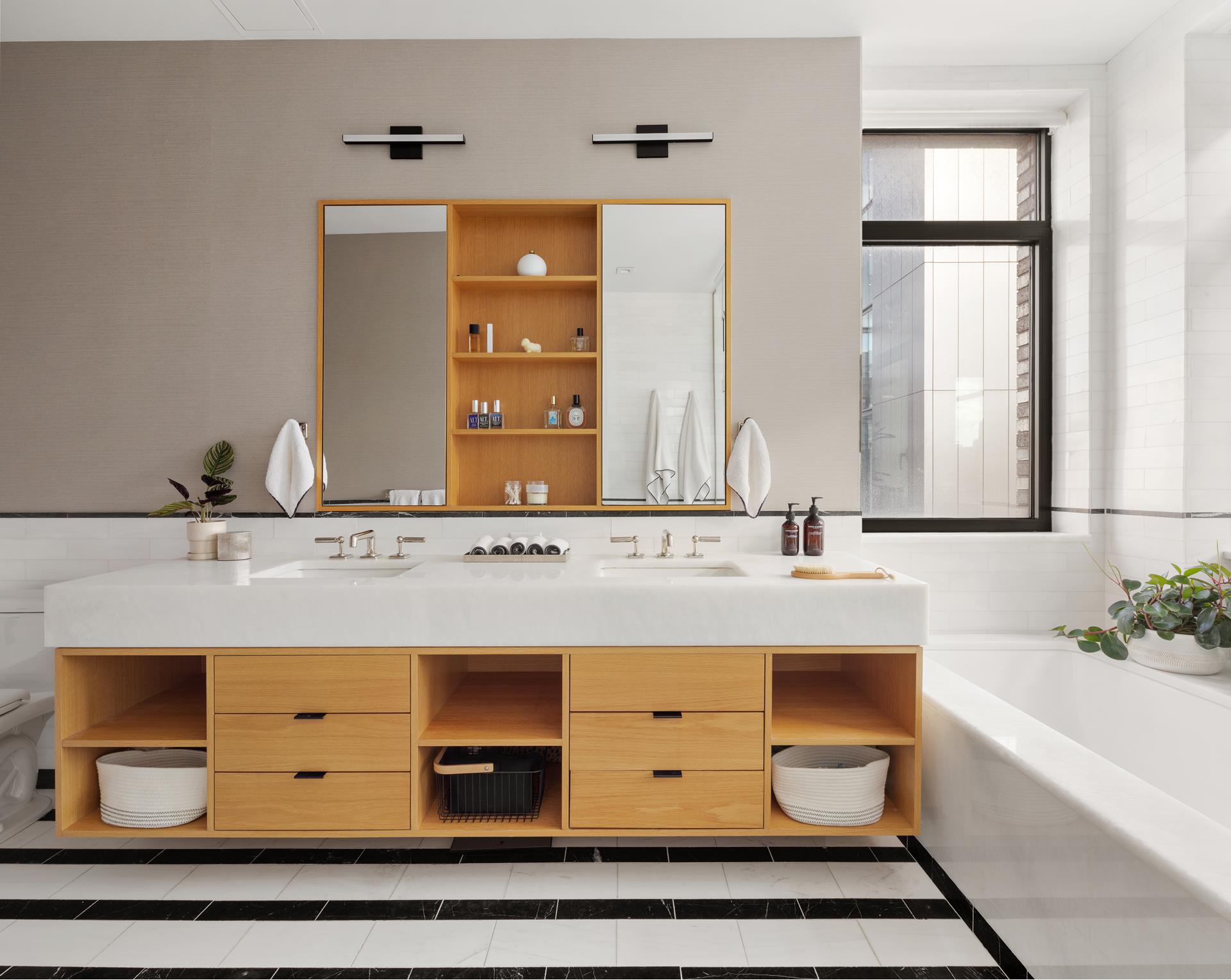 204 Forsyth Street, Unit PH6 Manhattan, NY 10002 - Photo 14 of 22 a bathroom with a sink double vanity and a mirror