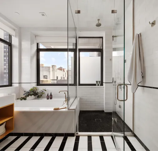 a bathroom with a sink double vanity and a mirror