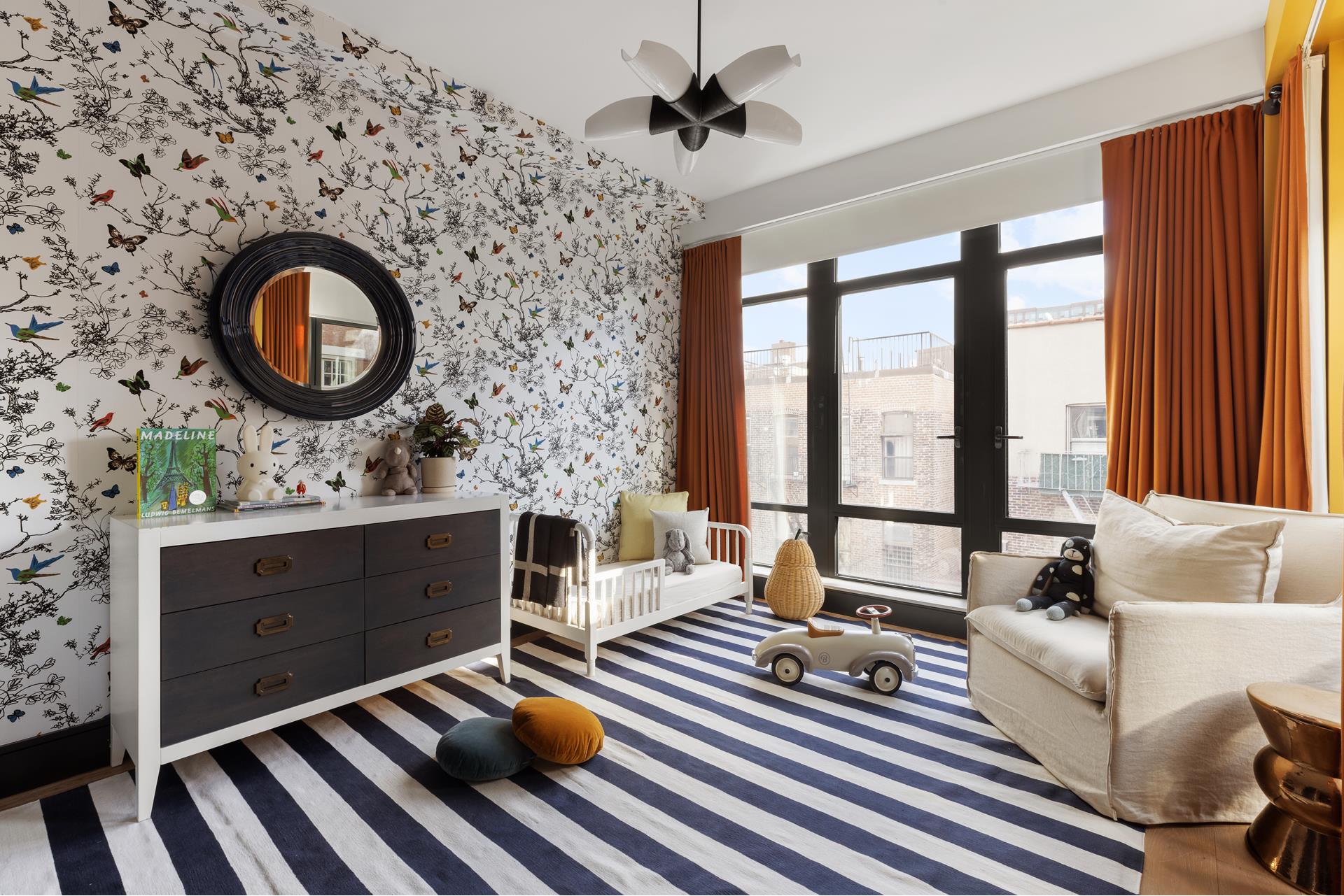 204 Forsyth Street, Unit PH6 Manhattan, NY 10002 - Photo 18 of 22 a living room with furniture a rug and a large window