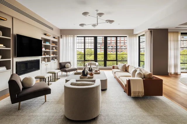 a living room with fireplace furniture and a flat screen tv