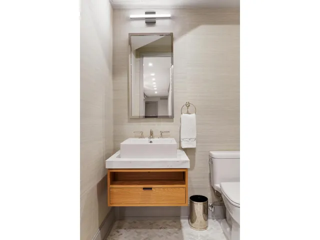 a view of a patio with couches chairs and a potted plant