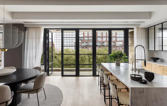 a living room with fireplace furniture and a flat screen tv