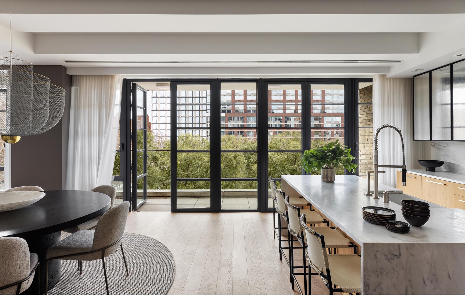 204 Forsyth Street, Unit PH6 Manhattan, NY 10002 - Photo 7 of 22 a view of a workspace with furniture and a window