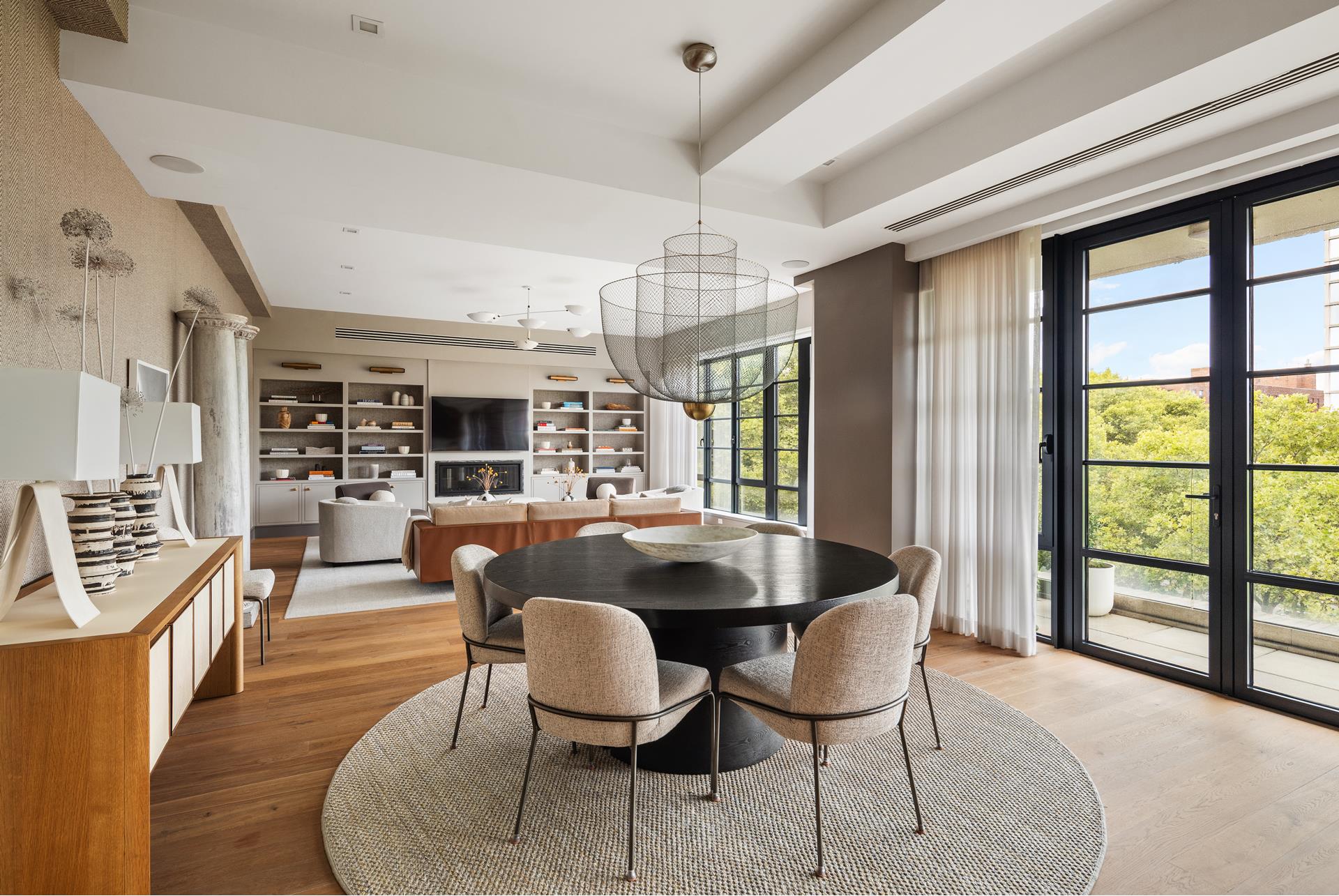 204 Forsyth Street, Unit PH6 Manhattan, NY 10002 - Photo 8 of 22 a dining room with furniture a chandelier and wooden floor