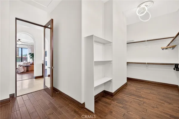 a view of a hallway view with wooden floor and staircase