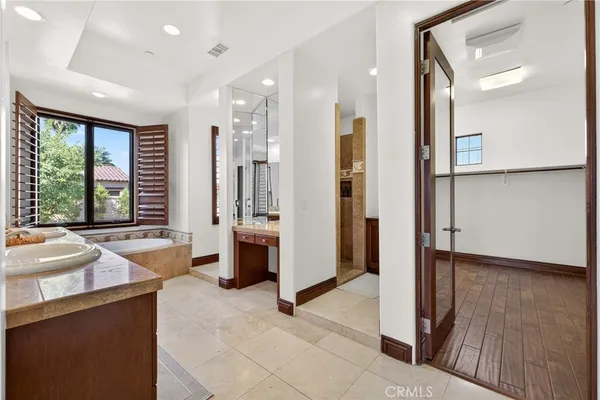 a large en suite bathroom with sink shower and bathtub