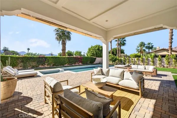 a view of a patio with couches chairs and a table