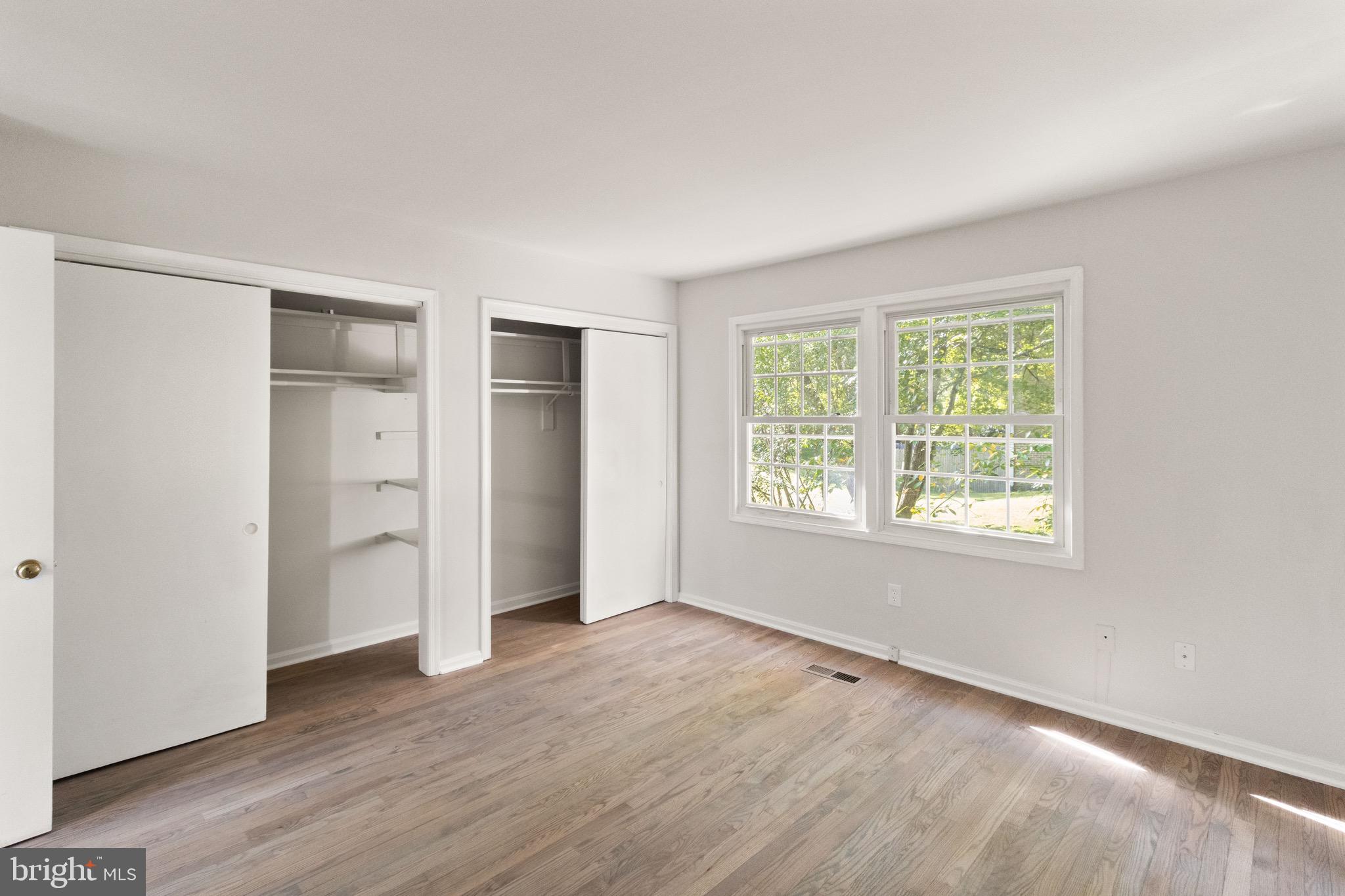 8519 Westover Court, Unit 763 Springfield, VA 22152 - Photo 17 of 36 wooden floor in an empty room with a window