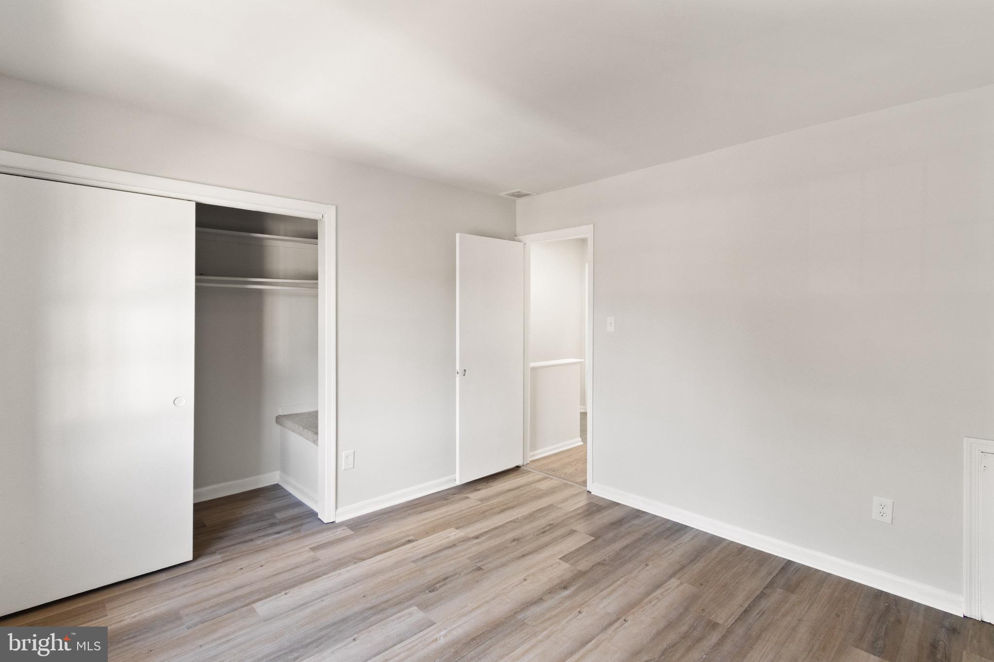 8519 Westover Court, Unit 763 Springfield, VA 22152 - Photo 23 of 36 a view of an empty room with wooden floor