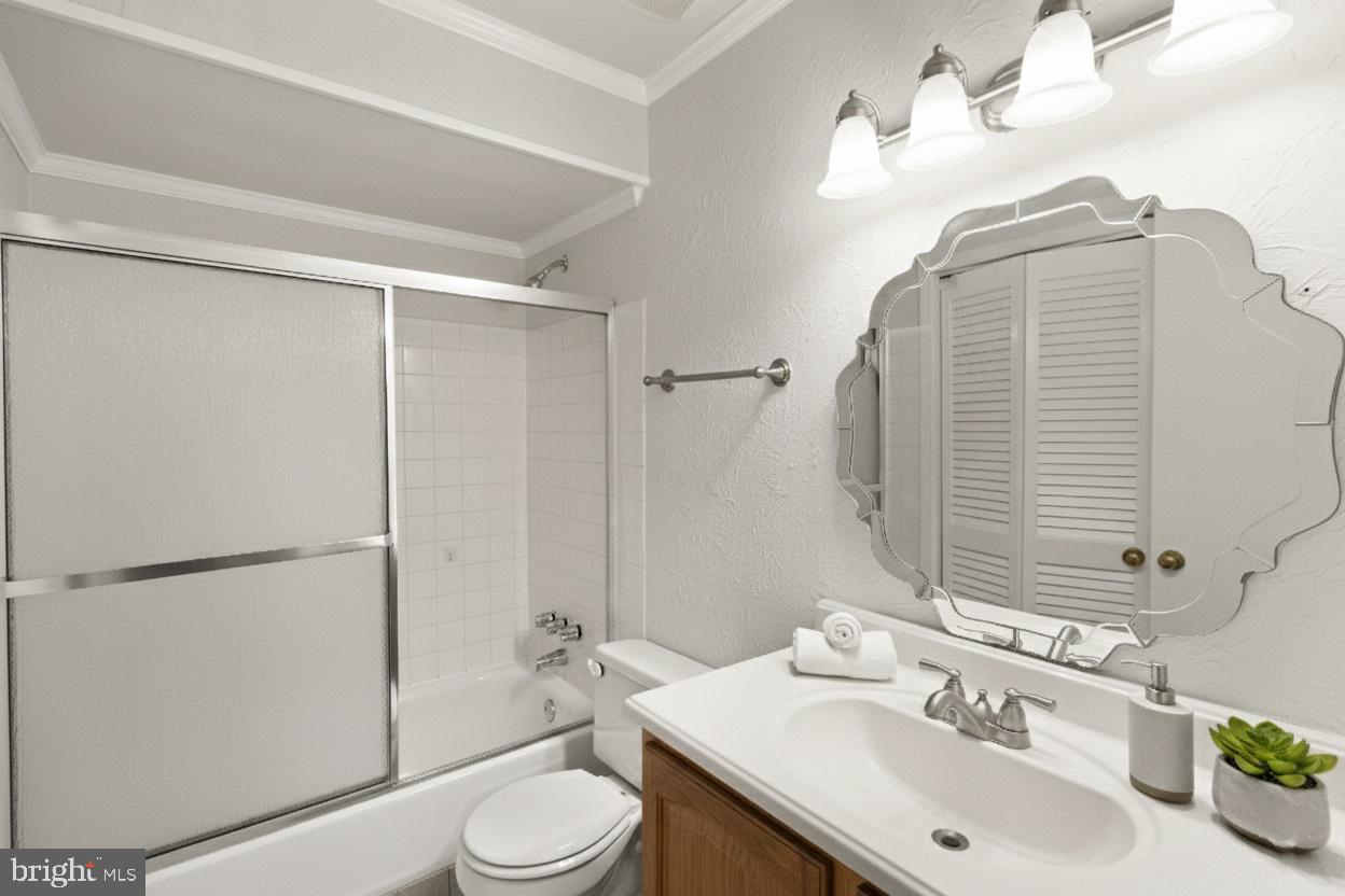 8519 Westover Court, Unit 763 Springfield, VA 22152 - Photo 25 of 36 a bathroom with a sink a toilet and shower