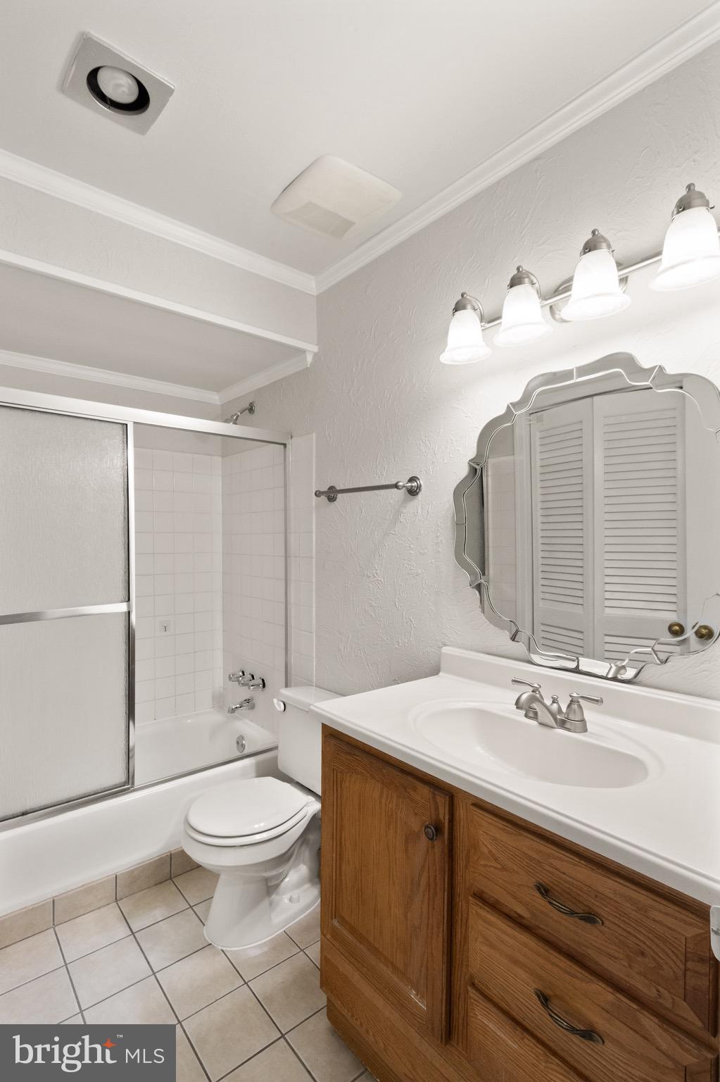 8519 Westover Court, Unit 763 Springfield, VA 22152 - Photo 26 of 36 a bathroom with a double vanity sink toilet and shower