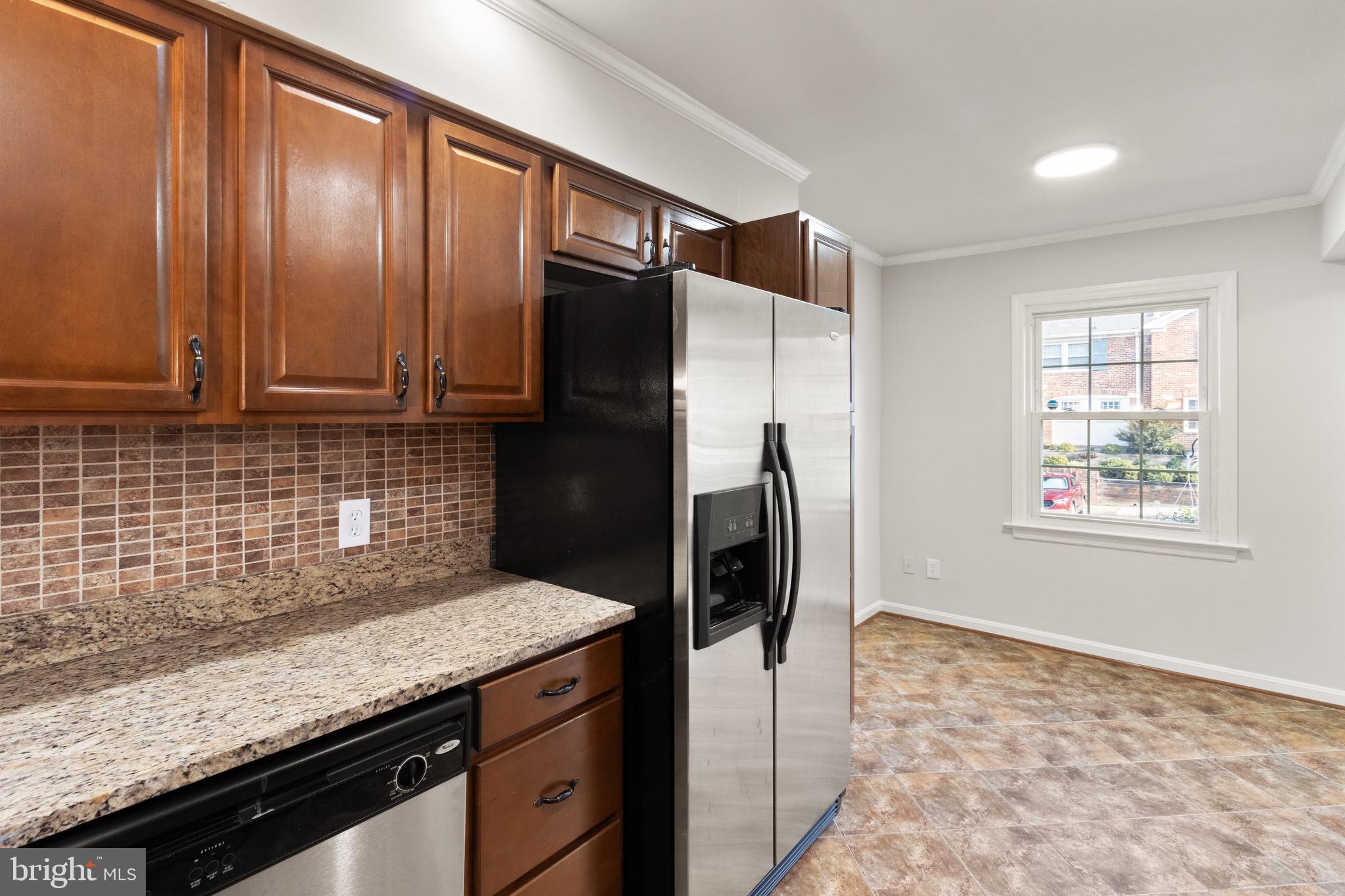 8519 Westover Court, Unit 763 Springfield, VA 22152 - Photo 31 of 36 a kitchen with stainless steel appliances granite countertop a refrigerator and a sink