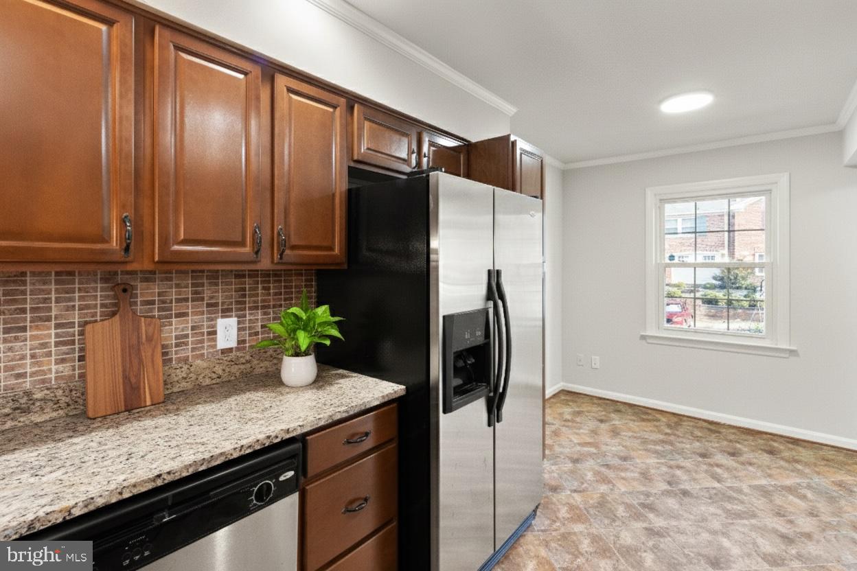 8519 Westover Court, Unit 763 Springfield, VA 22152 - Photo 7 of 36 a kitchen with stainless steel appliances granite countertop a refrigerator and a sink