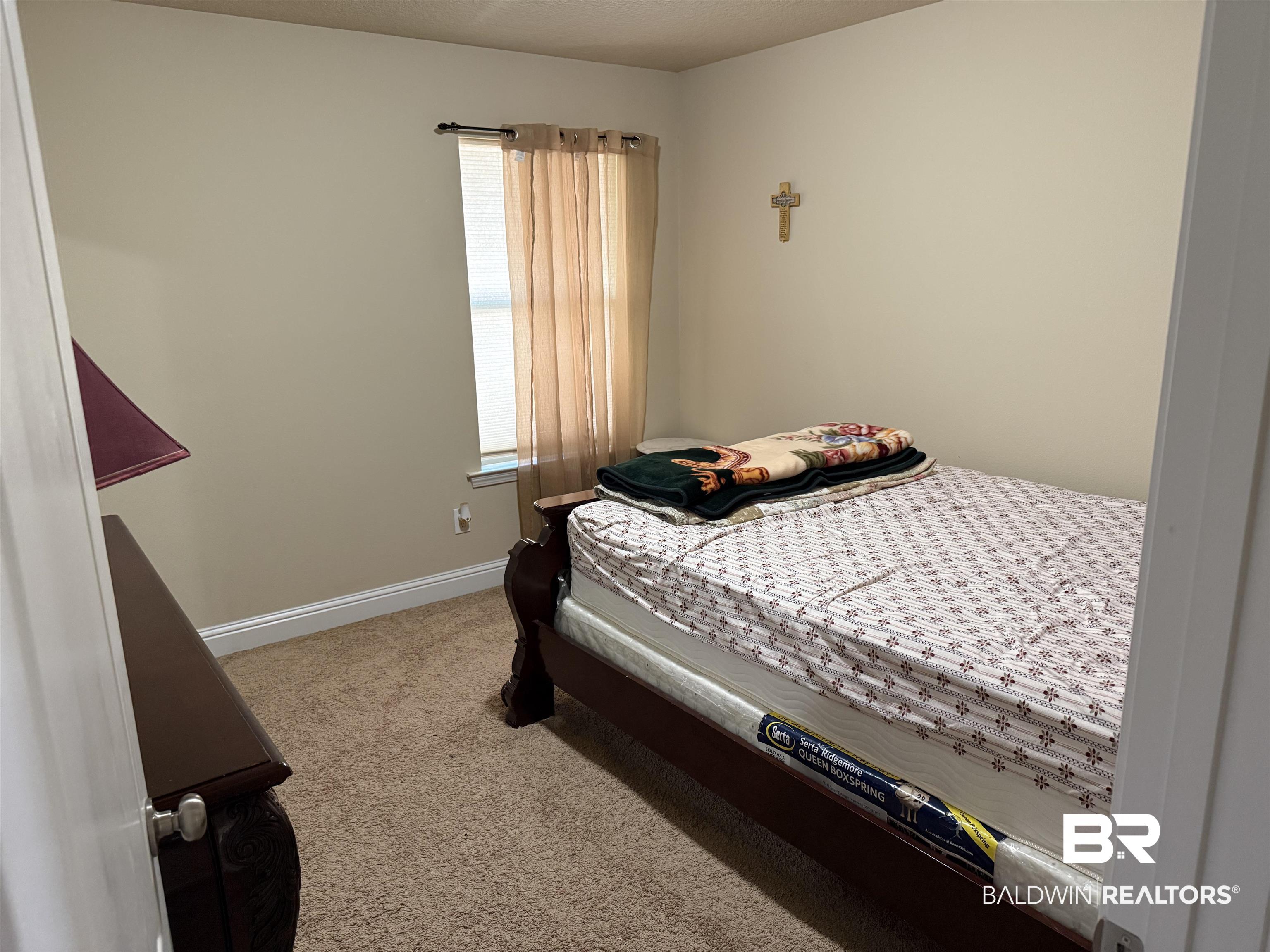 9023 Krystal Ridge Court Daphne, AL 36526 - Photo 27 of 41 Bedroom with light colored carpet and baseboards