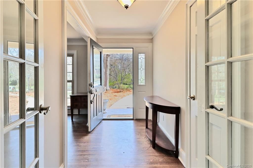 3532 Mountainbrook Road Charlotte, NC 28226 - Photo 11 of 45 a view of a hallway with a dining table and chairs