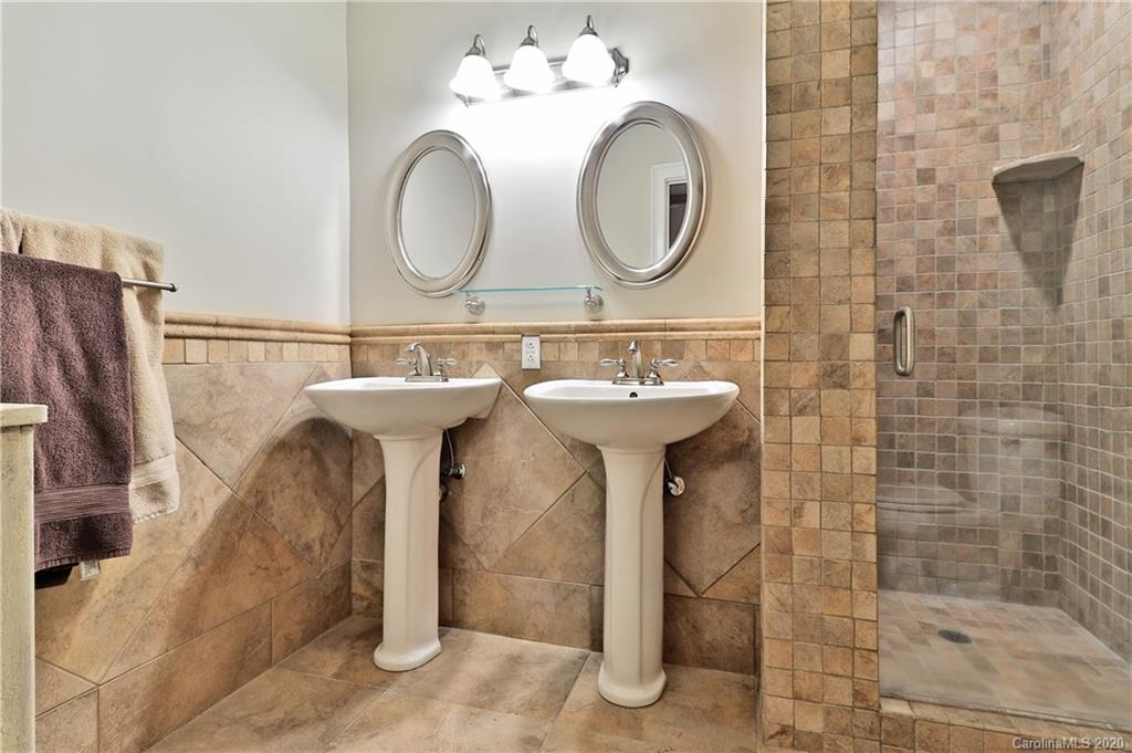 3532 Mountainbrook Road Charlotte, NC 28226 - Photo 14 of 45 a bathroom with a sink mirror and shower