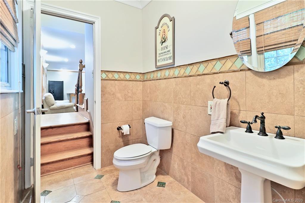 3532 Mountainbrook Road Charlotte, NC 28226 - Photo 15 of 45 a bathroom with a toilet sink and mirror