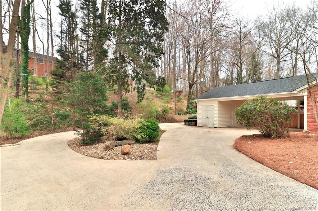3532 Mountainbrook Road Charlotte, NC 28226 - Photo 16 of 45 a view of a house with a yard and potted plants