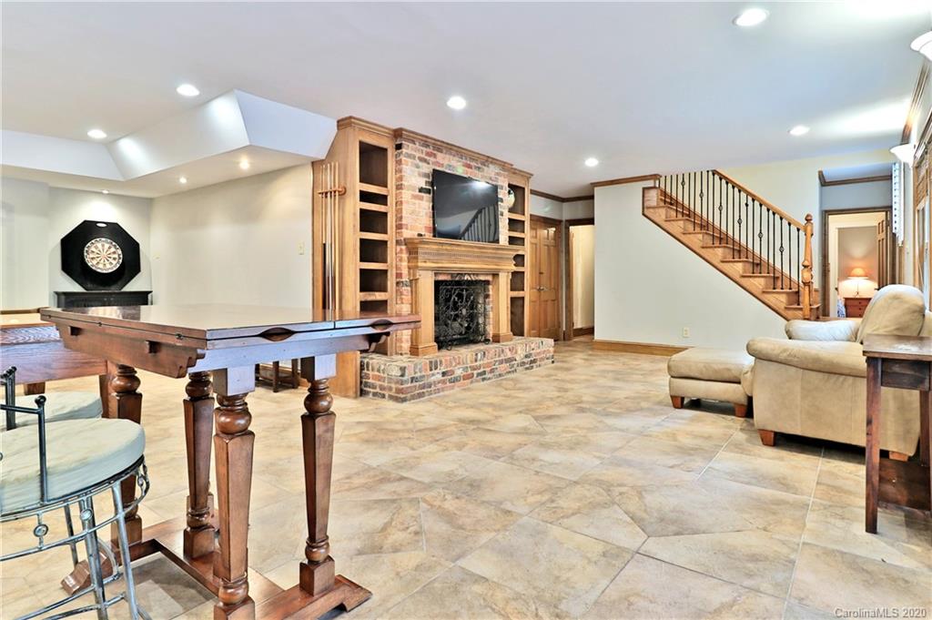 3532 Mountainbrook Road Charlotte, NC 28226 - Photo 25 of 45 a living room with furniture and a fireplace