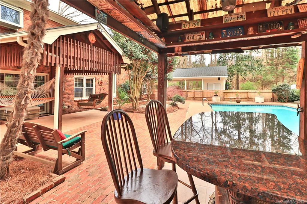 3532 Mountainbrook Road Charlotte, NC 28226 - Photo 27 of 45 a view of a patio with a table chairs and a backyard
