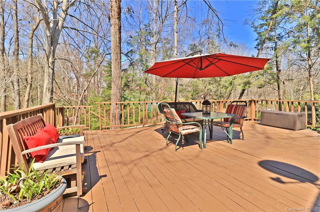 3532 Mountainbrook Road Charlotte, NC 28226 - Photo 29 of 45 an outdoor sitting area with red umbrella