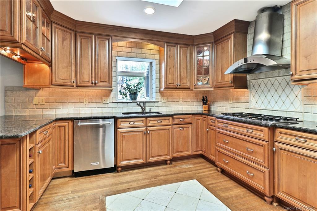 3532 Mountainbrook Road Charlotte, NC 28226 - Photo 4 of 45 a kitchen with stainless steel appliances granite countertop a sink and cabinets