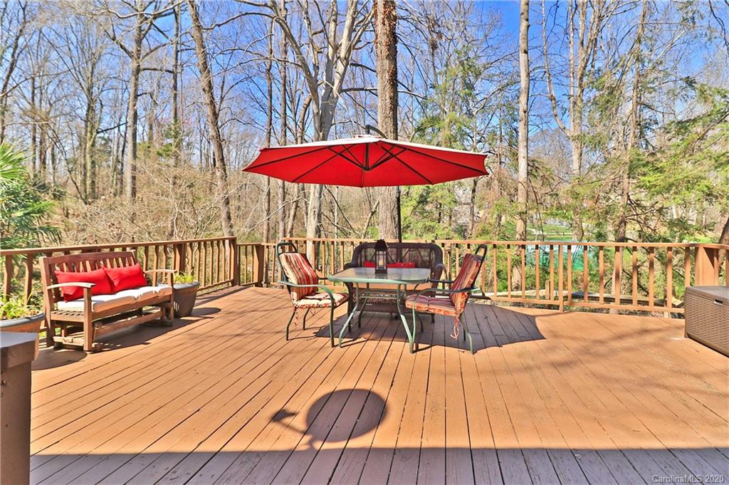 3532 Mountainbrook Road Charlotte, NC 28226 - Photo 32 of 45 an outdoor sitting area with red umbrella