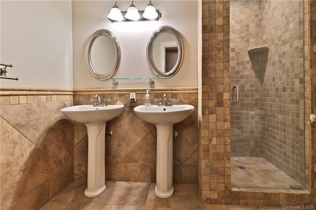 3532 Mountainbrook Road Charlotte, NC 28226 - Photo 36 of 45 a bathroom with a sink mirror and shower