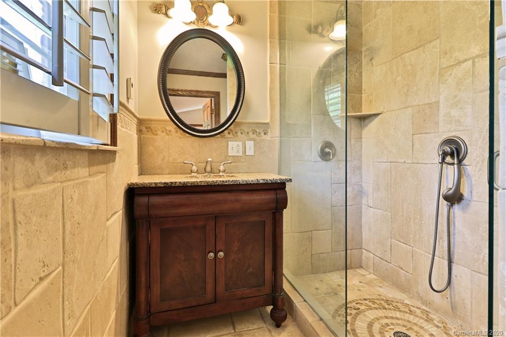 3532 Mountainbrook Road Charlotte, NC 28226 - Photo 37 of 45 a bathroom with a sink and a mirror