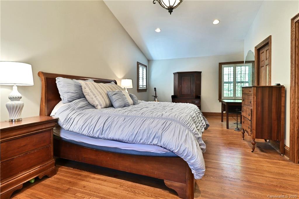 3532 Mountainbrook Road Charlotte, NC 28226 - Photo 38 of 45 a spacious bedroom with a bed and wooden floor