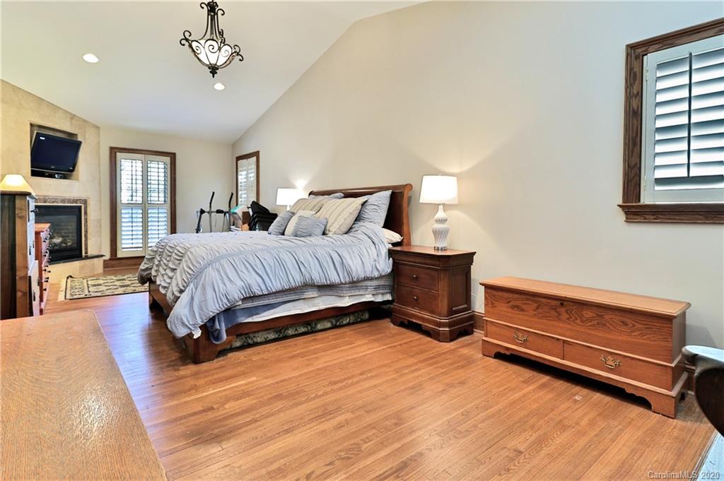 3532 Mountainbrook Road Charlotte, NC 28226 - Photo 39 of 45 a bedroom with a bed and a tv on table