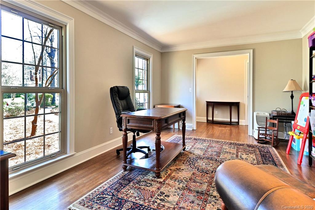 3532 Mountainbrook Road Charlotte, NC 28226 - Photo 6 of 45 a living room with furniture rug and a fireplace