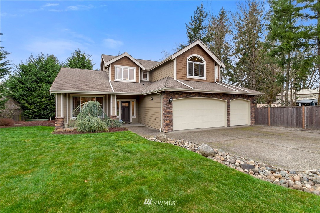 32233 Military Road South Federal Way, WA 98001 - Photo 1 of 28 a front view of a house with a garden and trees
